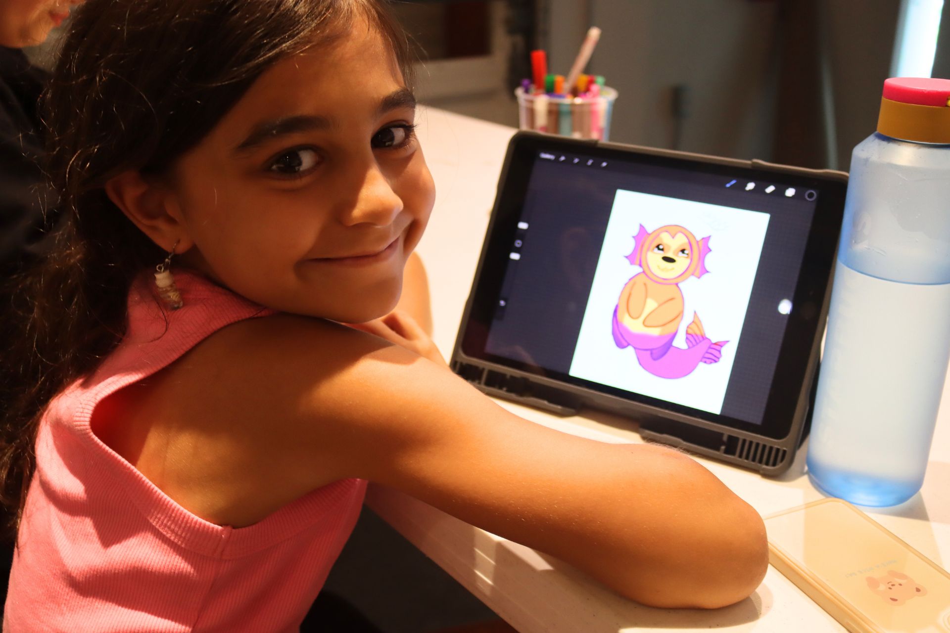Kid at iPad Explorations Art Class