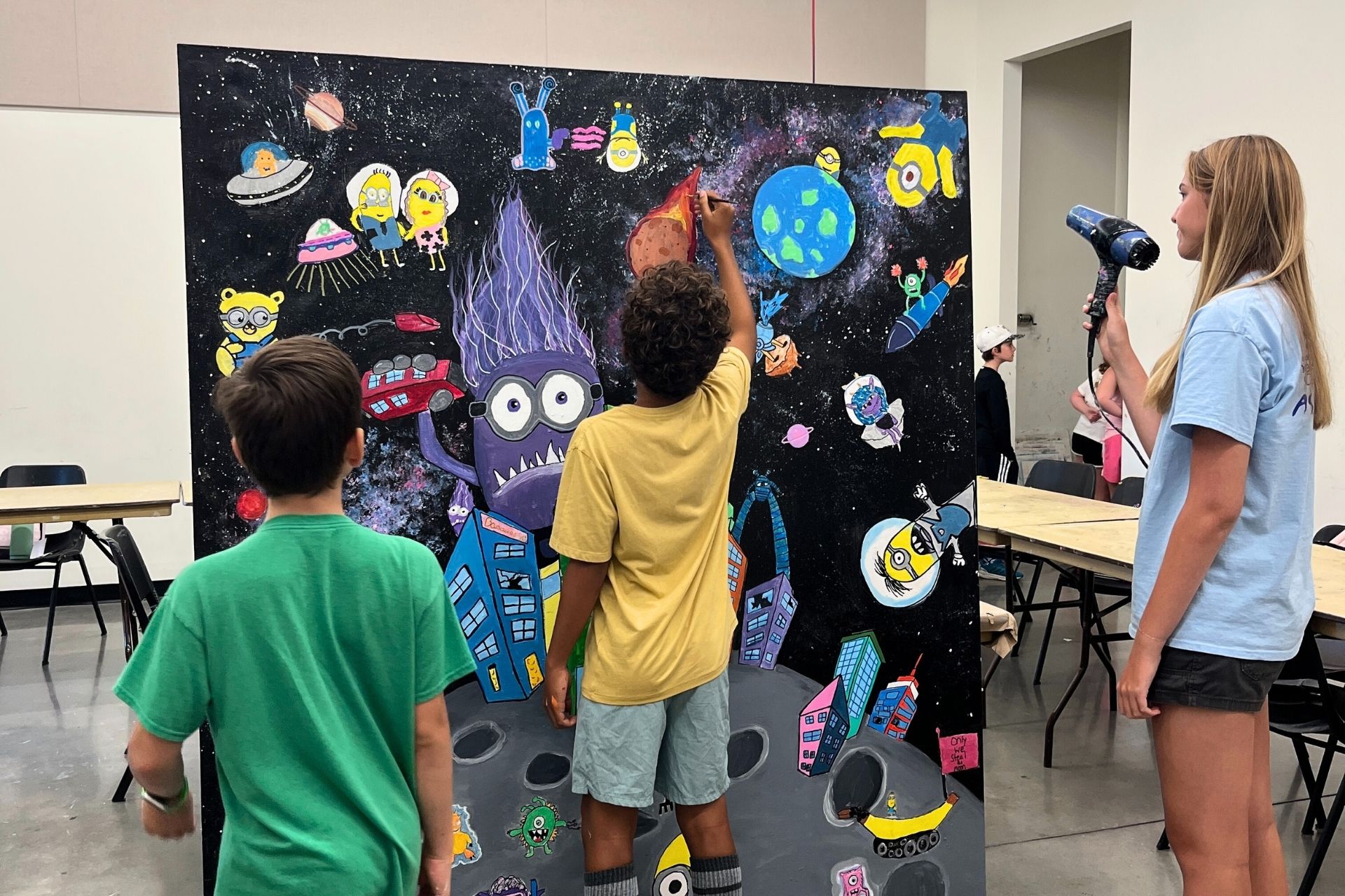 Kids creating mural at Summer Camp